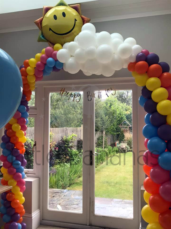 Raunbow balloon arch with sun and clouds
