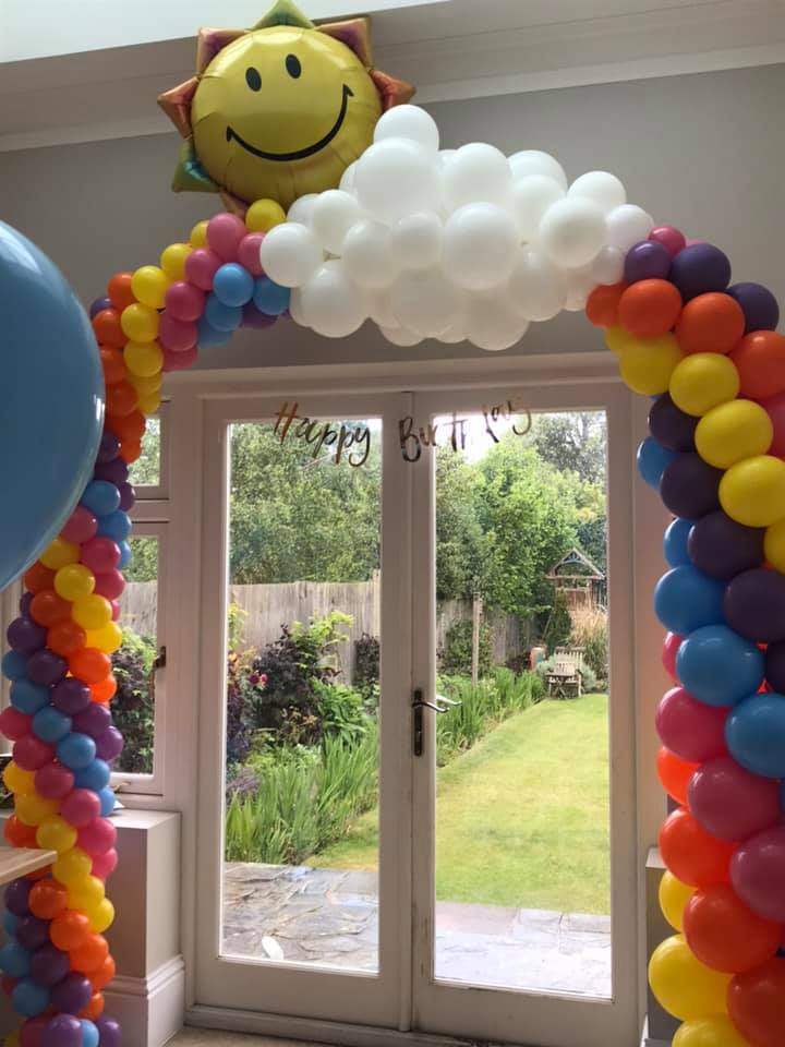 Rainbow balloon link arch with sun and cloud