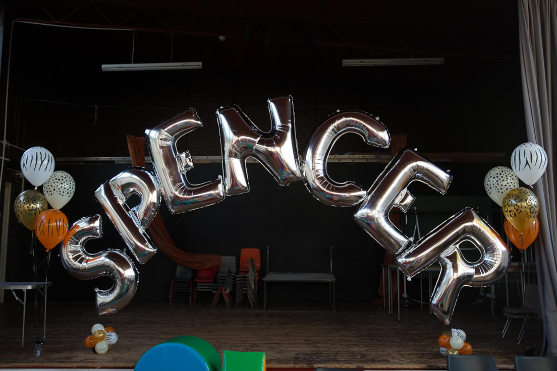 Foil Balloon Arch with letters spelling Spencer